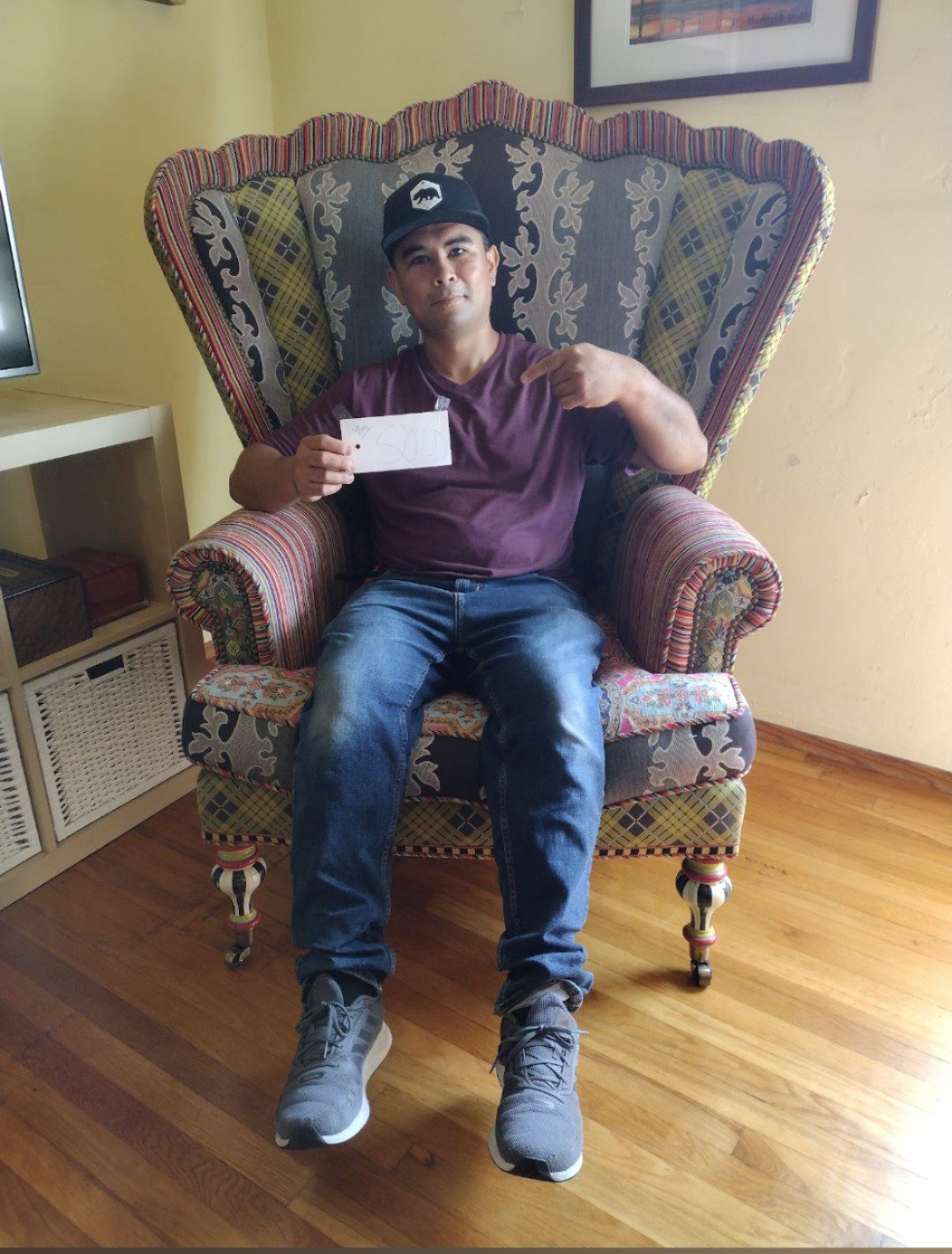 Man sitting on a fancy chair